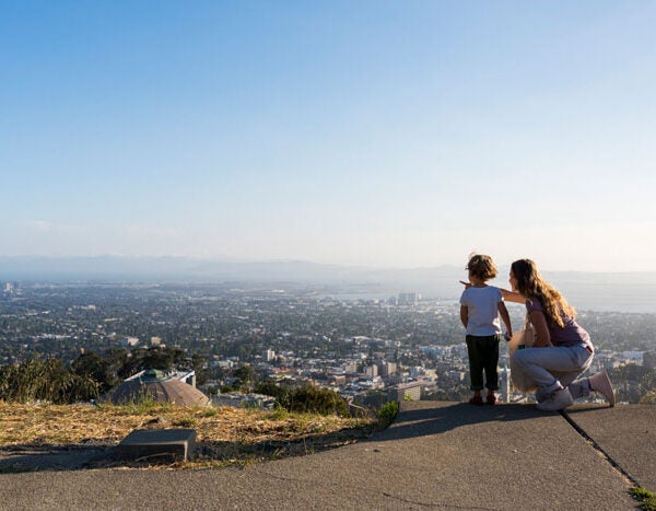View from The Lawrence where two visitors are looking out over the bay