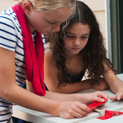 Two girls working on a project